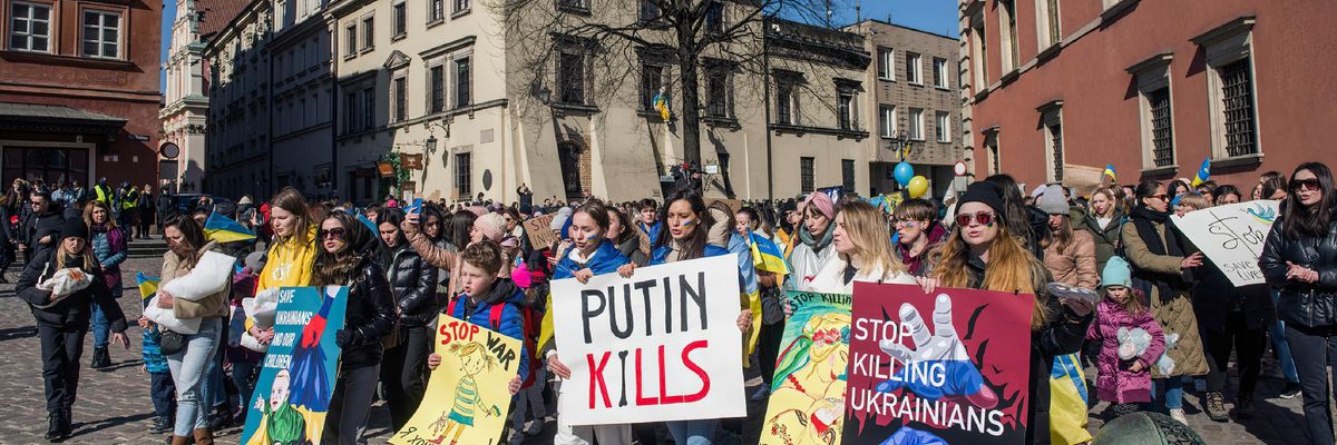 Ukrainian women and children, many who just fled to Poland, take part in a "March of Ukrainian Mothers" Friday in Warsaw.