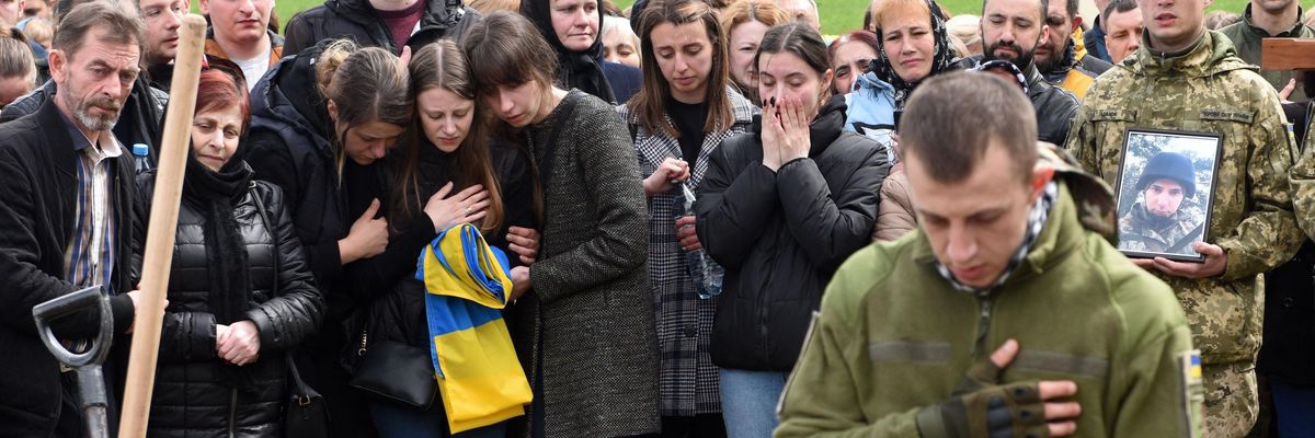 Ukrainians mourn at graveside of soldier killed in war