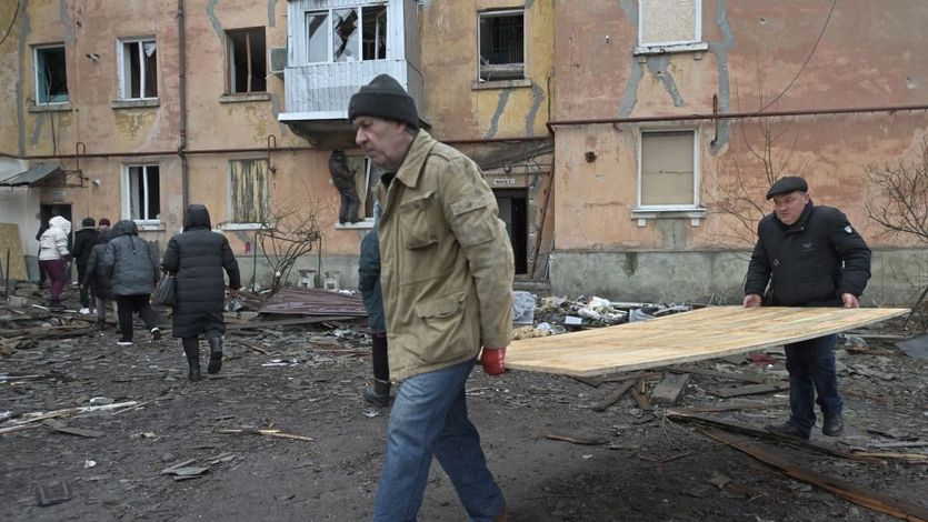 Ukrainians rebuild buildings damaged by missile strikes