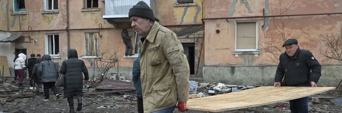 Ukrainians rebuild buildings damaged by missile strikes
