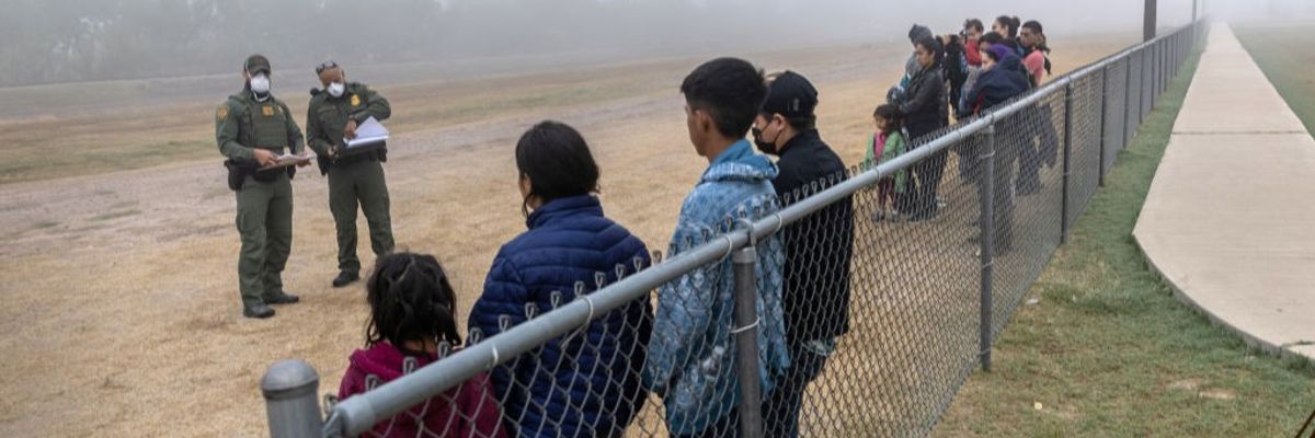 Unaccompanied minors are grouped apart from families at the border