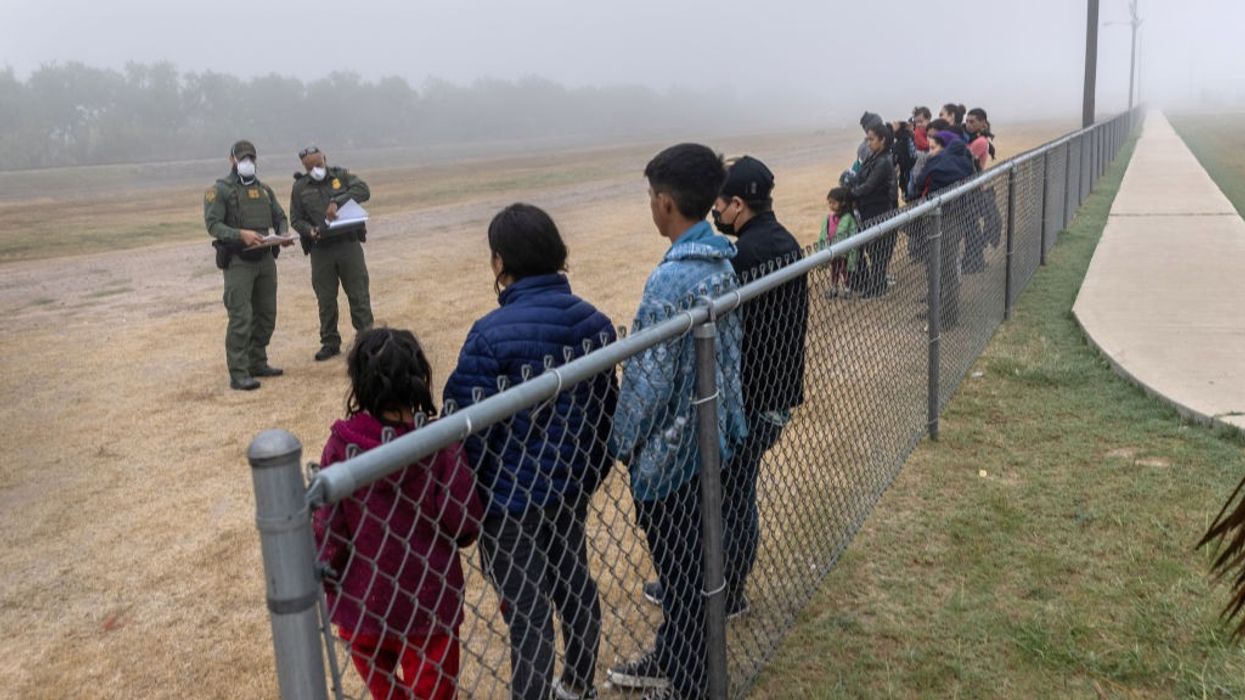 Unaccompanied minors are grouped apart from families at the border