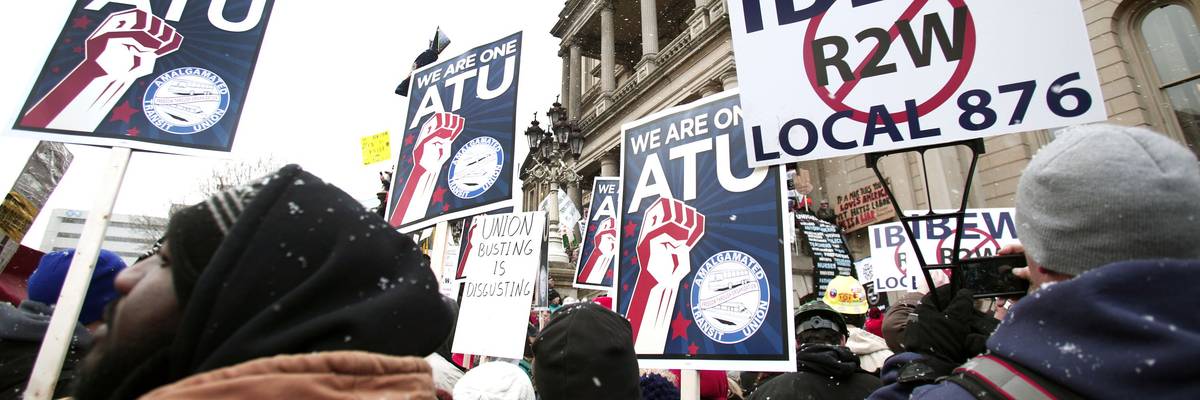 Union members from around the U.S. rally at the Michigan State Capitol