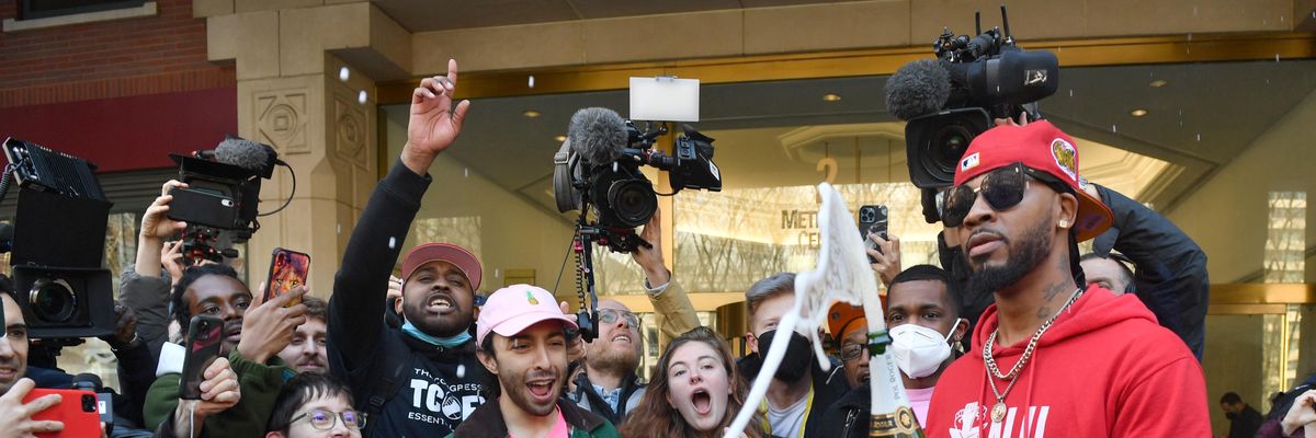 Union organizer Christian Smalls celebrates with Amazon workers following the vote to unionize a Staten Island, New York warehouse on April 1, 2022.
