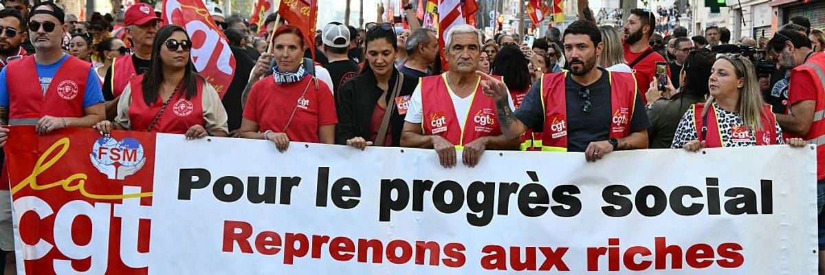 Unionists hold a banner during a protest in France