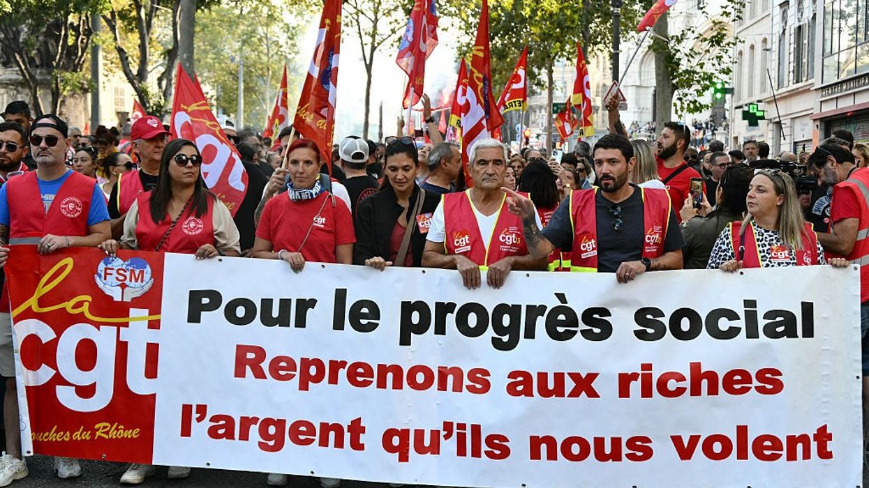 Unionists hold a banner during a protest in France