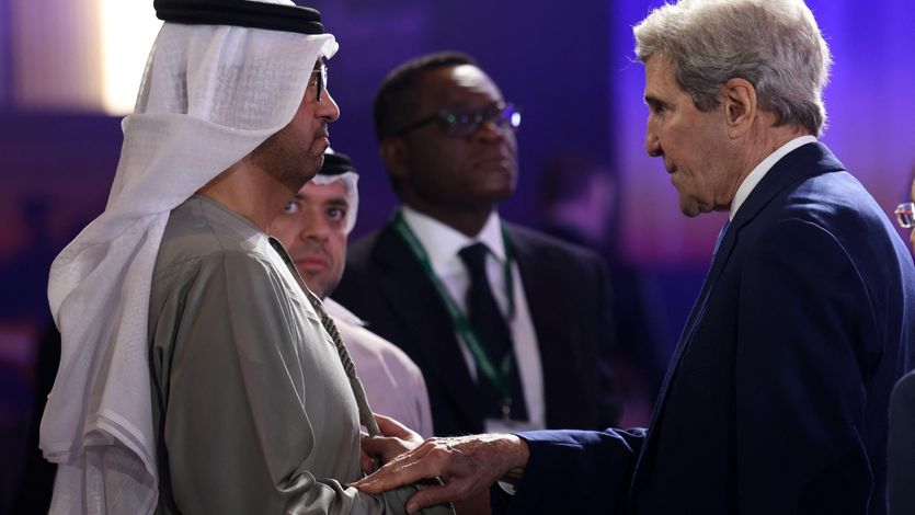United Arab Emirates' minister of industry and CEO of the Abu Dhabi National Oil Company, Sultan Ahmed al-Jaber, speaks to U.S. Special Presidential Envoy for Climate John Kerry at the opening session of the Atlantic Council Global Energy Forum in Abu Dhabi on January 14, 2023.