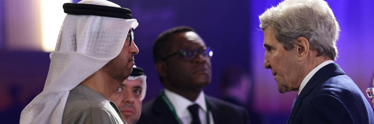 United Arab Emirates' minister of industry and CEO of the Abu Dhabi National Oil Company, Sultan Ahmed al-Jaber, speaks to U.S. Special Presidential Envoy for Climate John Kerry at the opening session of the Atlantic Council Global Energy Forum in Abu Dhabi on January 14, 2023.