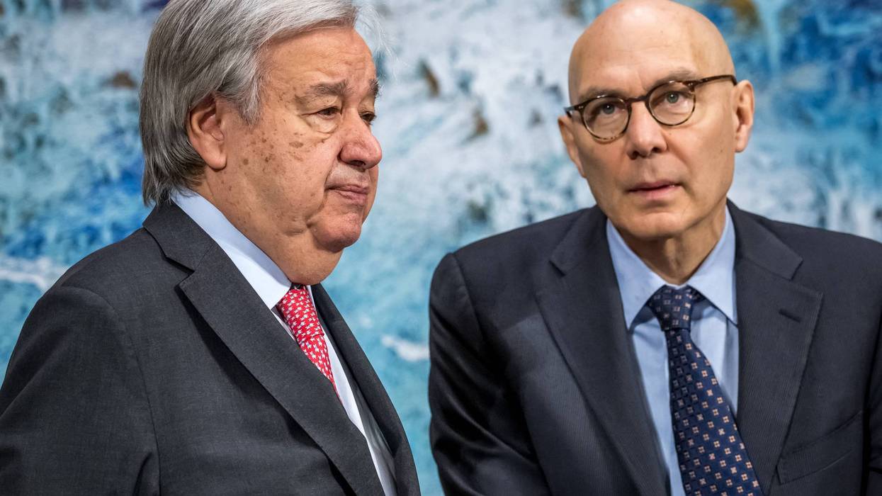 United Nations Secretary-General António Guterres (L) stands next to UN High Commissioner for Human Rights Volker Türk