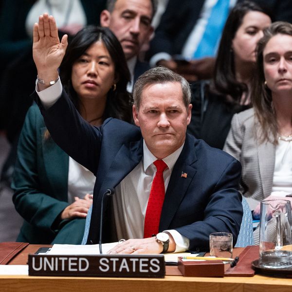US Ambassador to the UN raises his hand to vote in favor of a resolution establishing a so-called internaitonal stabilization force in Gaza