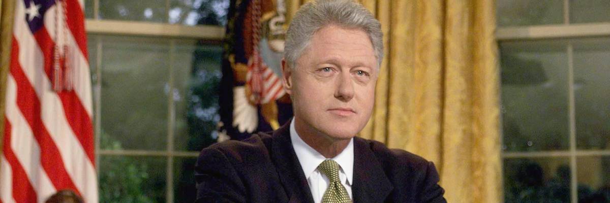 US President Bill Clinton poses for photographs