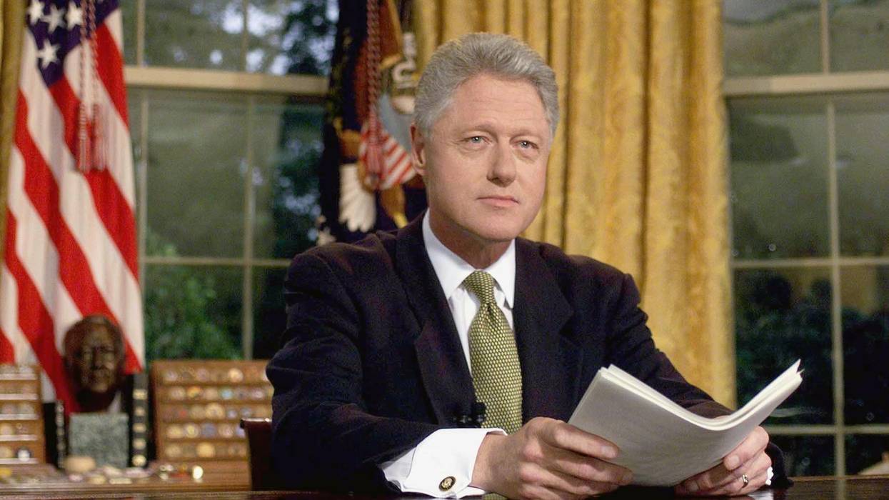 US President Bill Clinton poses for photographs