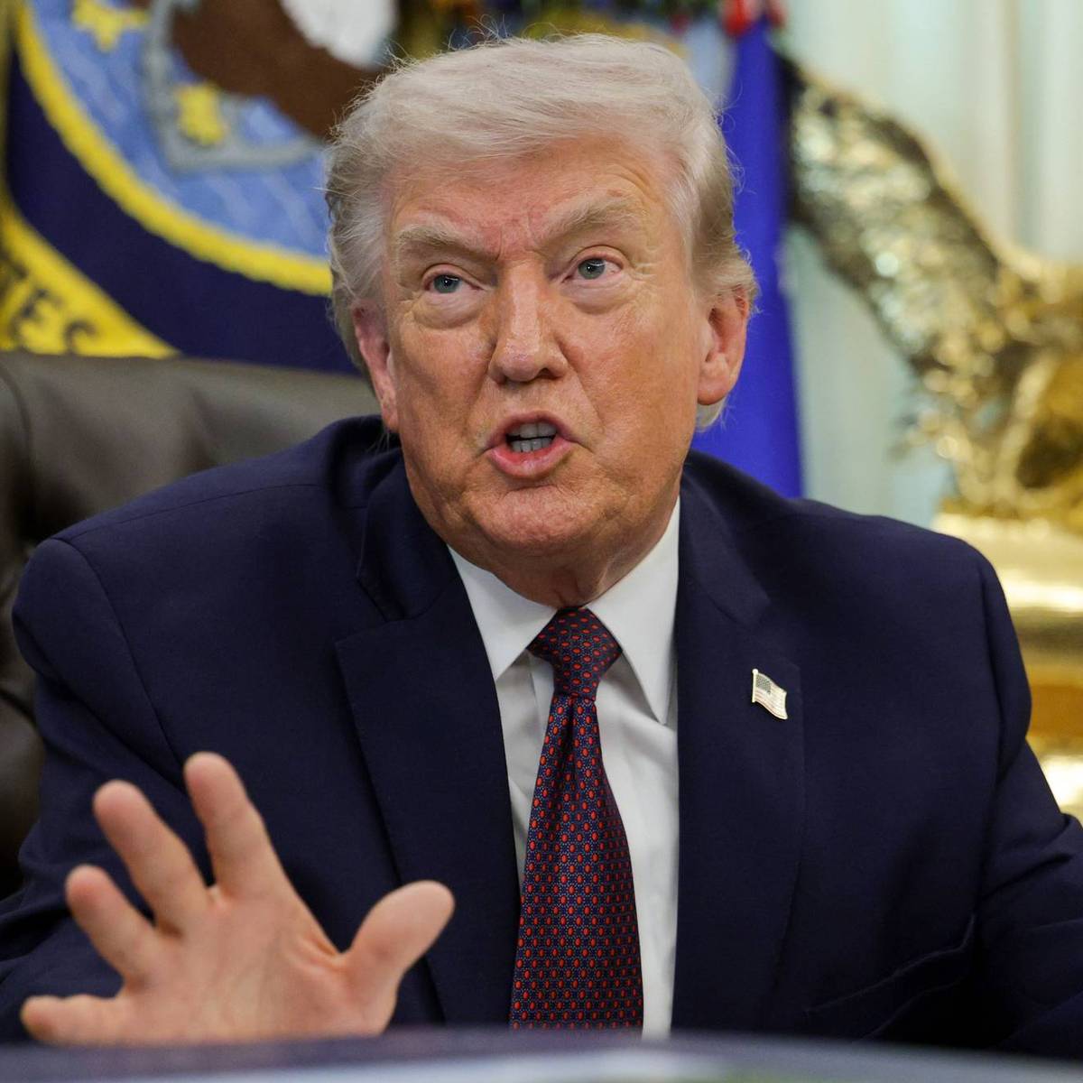 US President Donald Trump answers questions after signing an executive order to limit mail-in voting in the Oval Office of the White House on March 31, 2026 in Washington, DC.