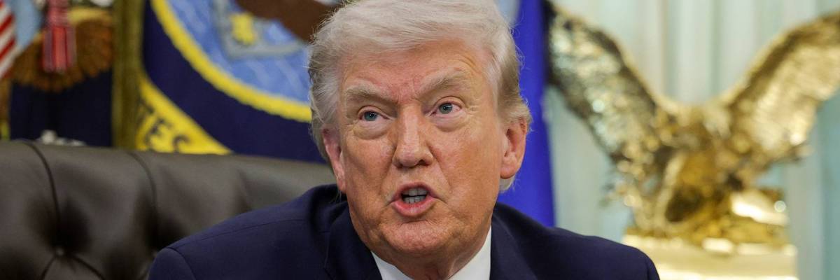 US President Donald Trump answers questions after signing an executive order to limit mail-in voting in the Oval Office of the White House on March 31, 2026 in Washington, DC.