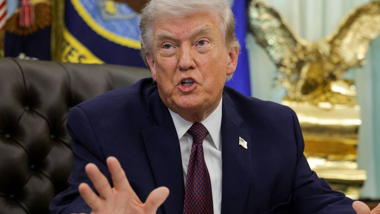 US President Donald Trump answers questions after signing an executive order to limit mail-in voting in the Oval Office of the White House on March 31, 2026 in Washington, DC.
