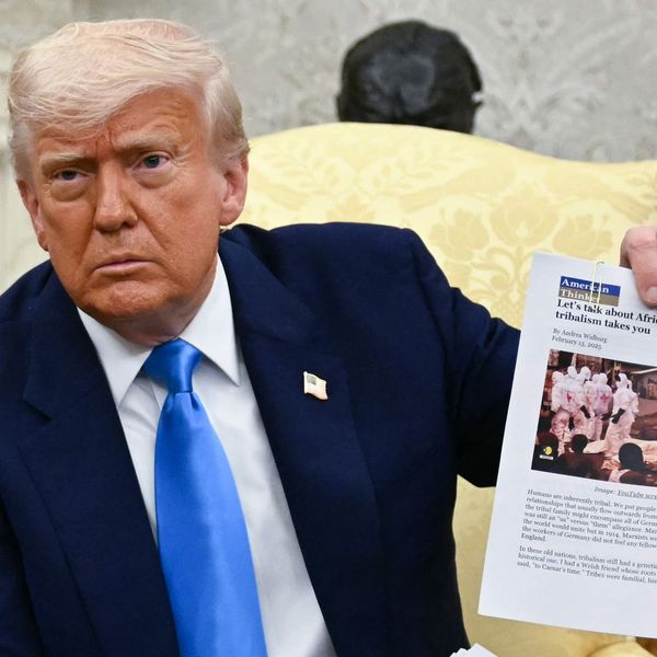 US President Donald Trump displays an article about Afrikaners as he meets with South African President Cyril Ramaphosa