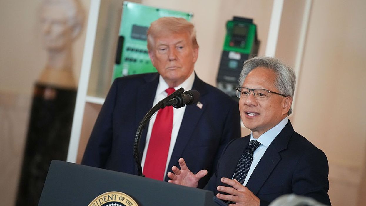 US President Donald Trump listens as Nvidia CEO Jensen Huang speaks