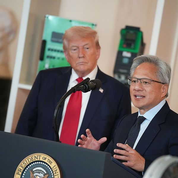 US President Donald Trump listens as Nvidia CEO Jensen Huang speaks