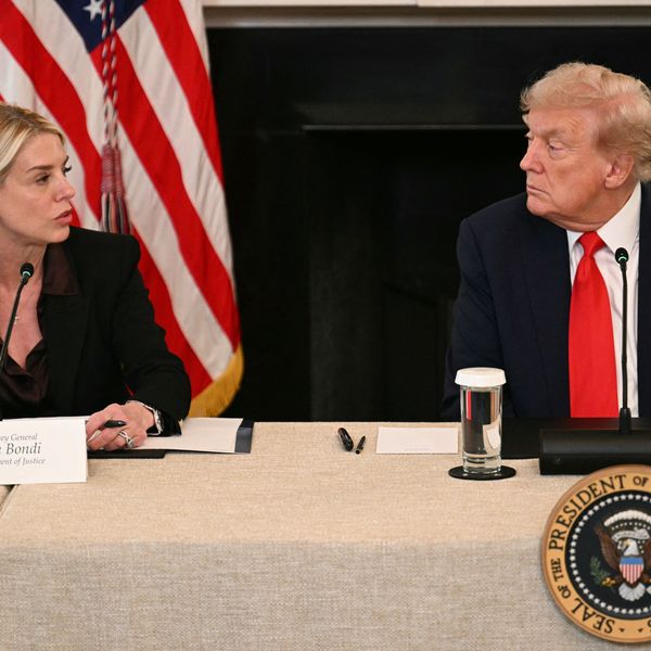 US President Donald Trump listens to Attorney General Pam Bondi
