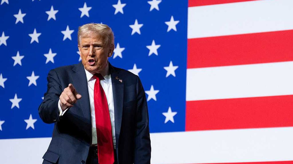 US President Donald Trump points to generals after his speech