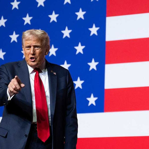 US President Donald Trump points to generals after his speech