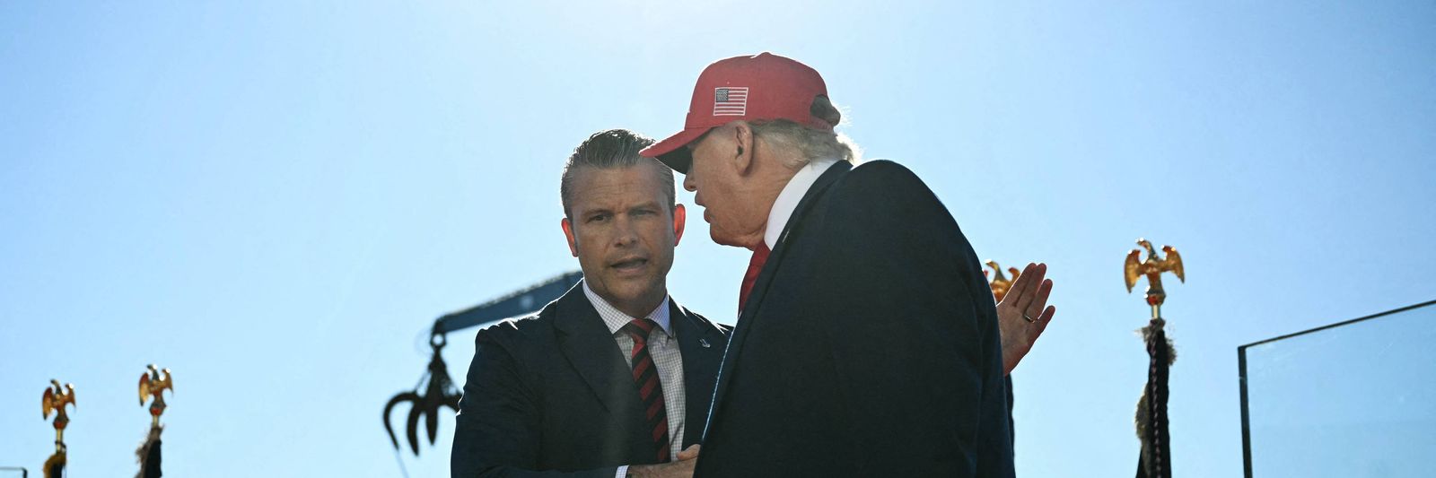 us-president-donald-trump-shakes-hands-with-defense-secretary-pete-hegseth.jpg?id=68402099&width=1200&height=400&coordinates=0%2C590%2C0%2C1077