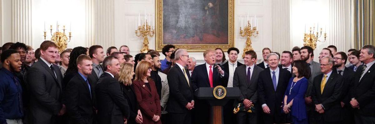 US President Donald Trump speaks behind a table of fast-food during an event in honor of the 2018 Division I FCS National Champions: The North Dakota State Bison in the State Dining Room of the White House in Washington, DC on March 4, 2019
