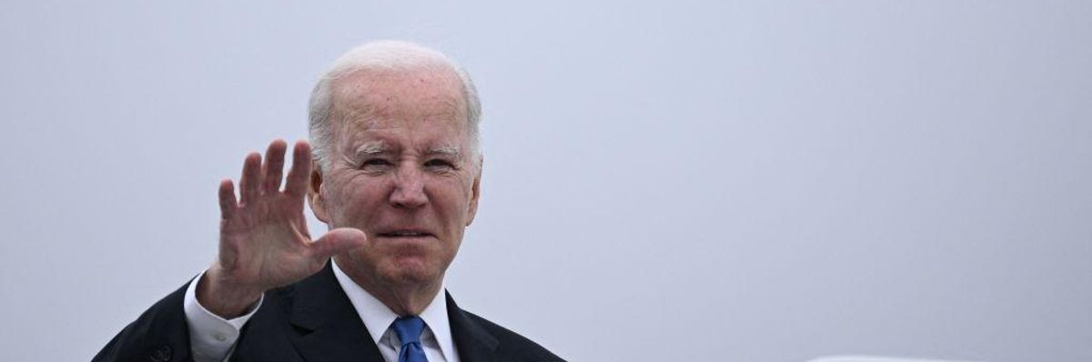 US President Joe Biden waves