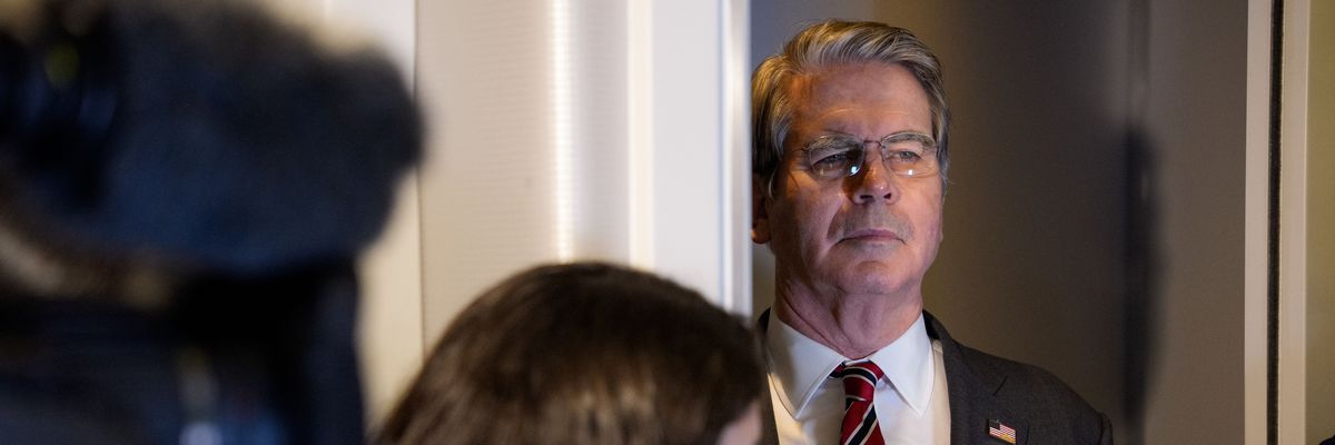 US Treasury Secretary Scott Bessent listens as President Donald Trump speaks