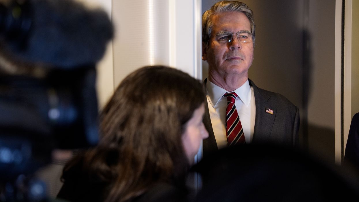 US Treasury Secretary Scott Bessent listens as President Donald Trump speaks