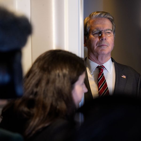 US Treasury Secretary Scott Bessent listens as President Donald Trump speaks