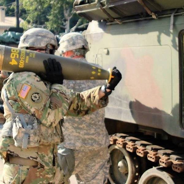 US troops carry a cluster round