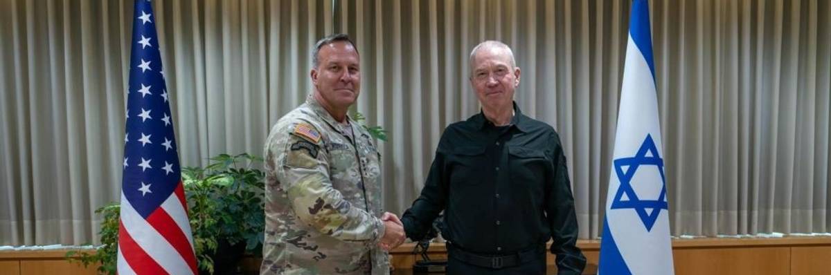 USA and Israeli flags behind military leaders