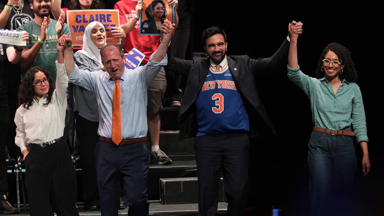 Valdez, Lander, Mamdani, and Chevalier hold raised hands at a rally.