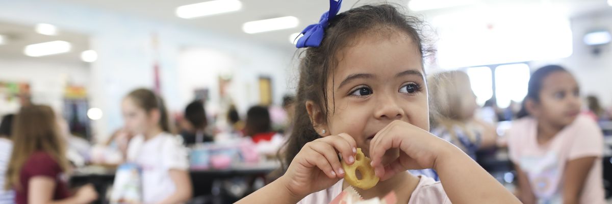 Valerie Yanez eats a smiley face fry during her lunch period