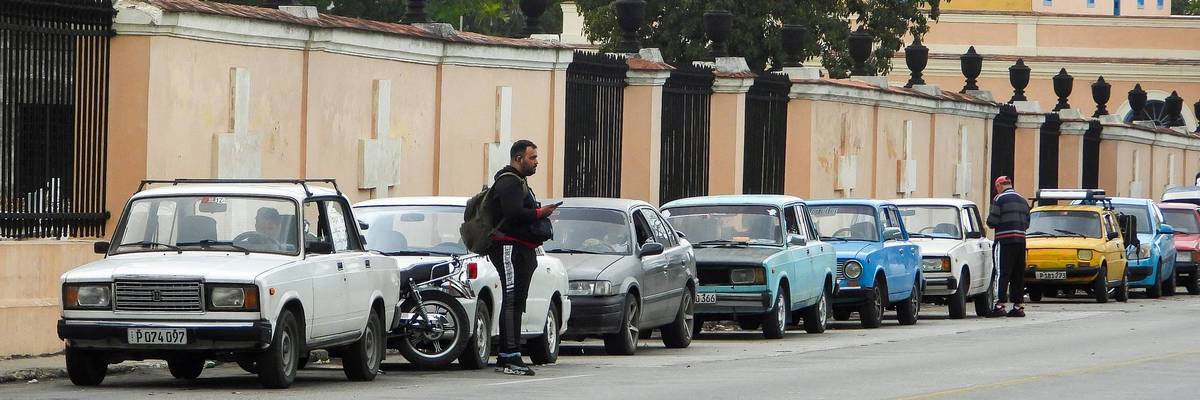 Vehicles wait to refuel in Cuba