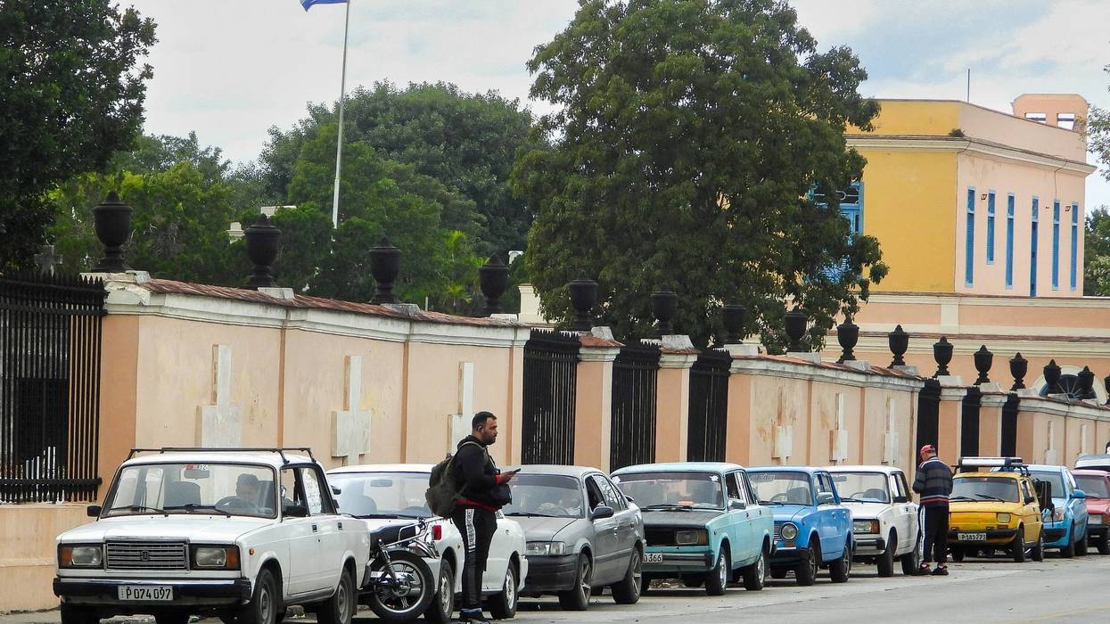 Vehicles wait to refuel in Cuba