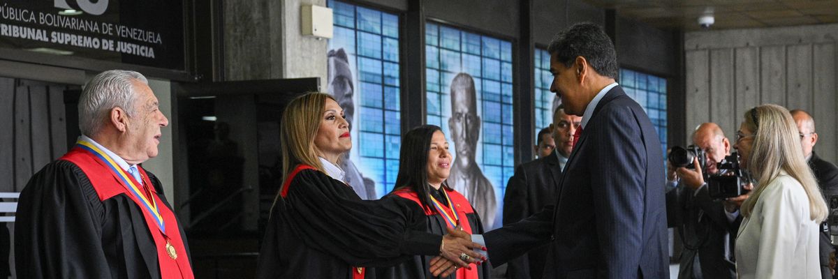 Venezuelan President Nicolás Maduro greets the president of the Venezuela's Supreme Court of Justice