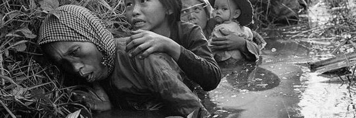 Vietnamese family hide in water
