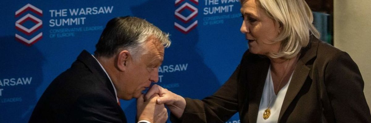 Viktor Orbán kisses Marine Le Pen's hand