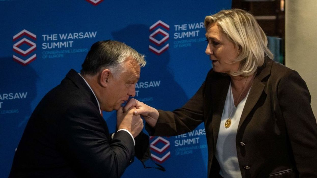 Viktor Orbán kisses Marine Le Pen's hand
