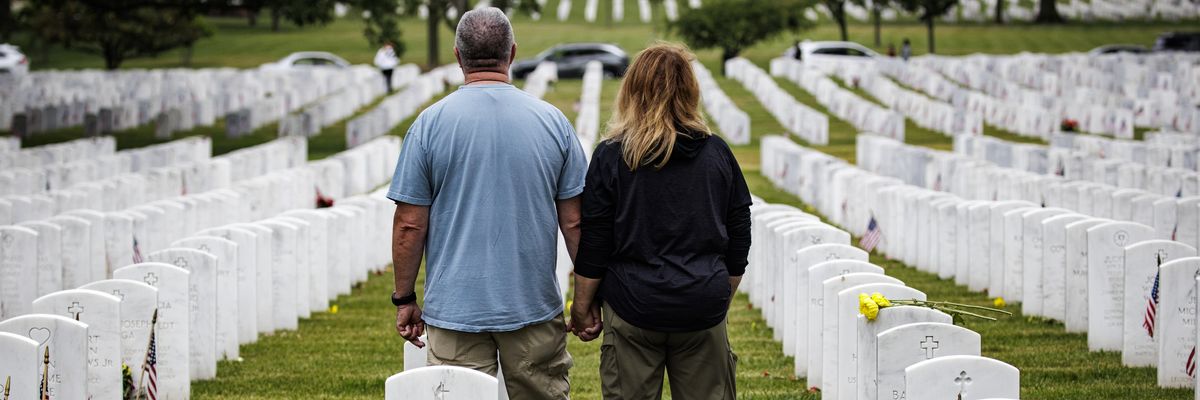 Visitors pay their respects in Arlington National Cemetery on Memorial Day, May 29, 2023, in Arlington, Virginia.