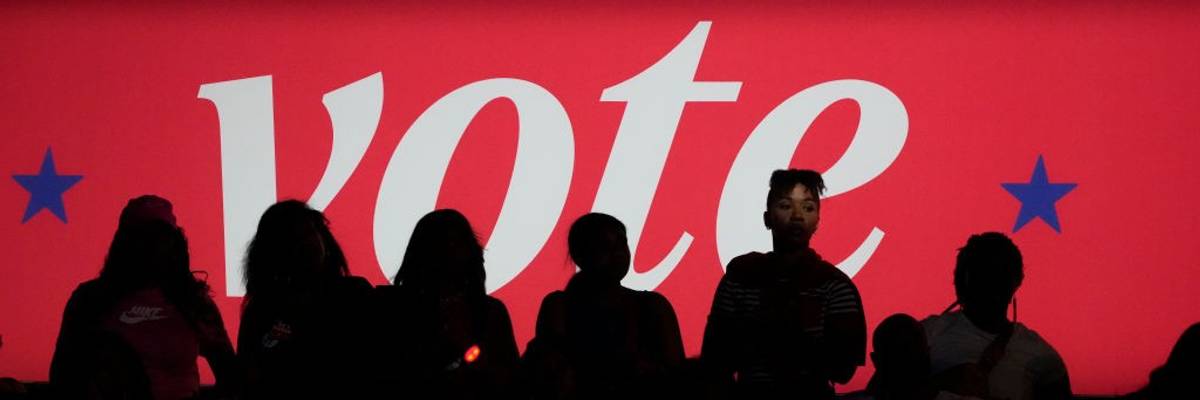 "Vote" banner at Harris rally in 2024