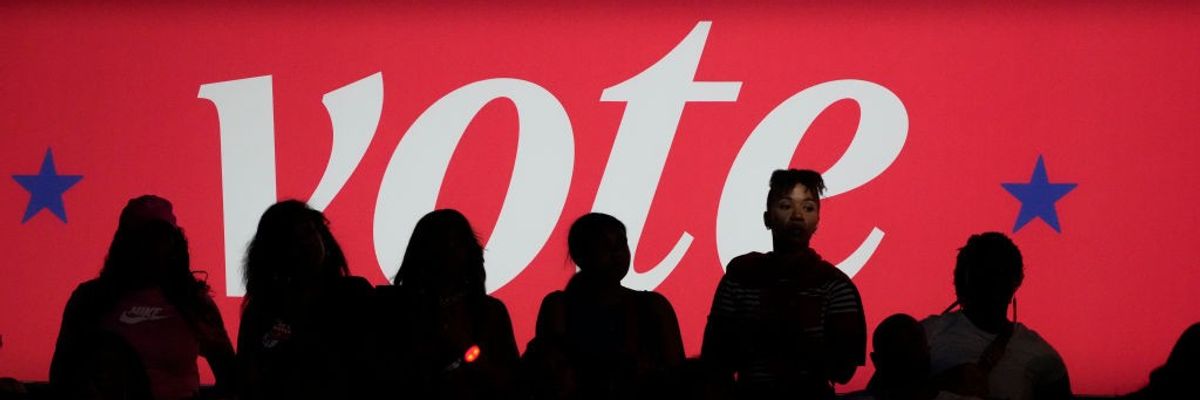 "Vote" banner at Harris rally in 2024