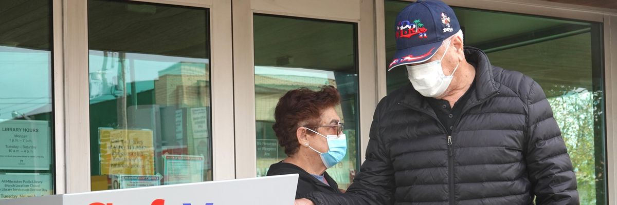 Voter casts absentee ballot using drop box