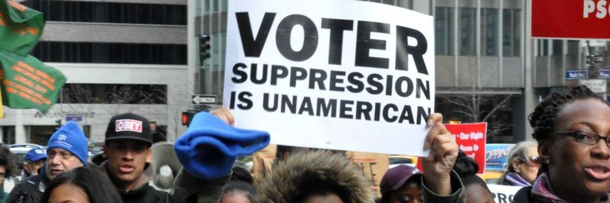 "Voter Suppression Is UnAmerican" the sign reads