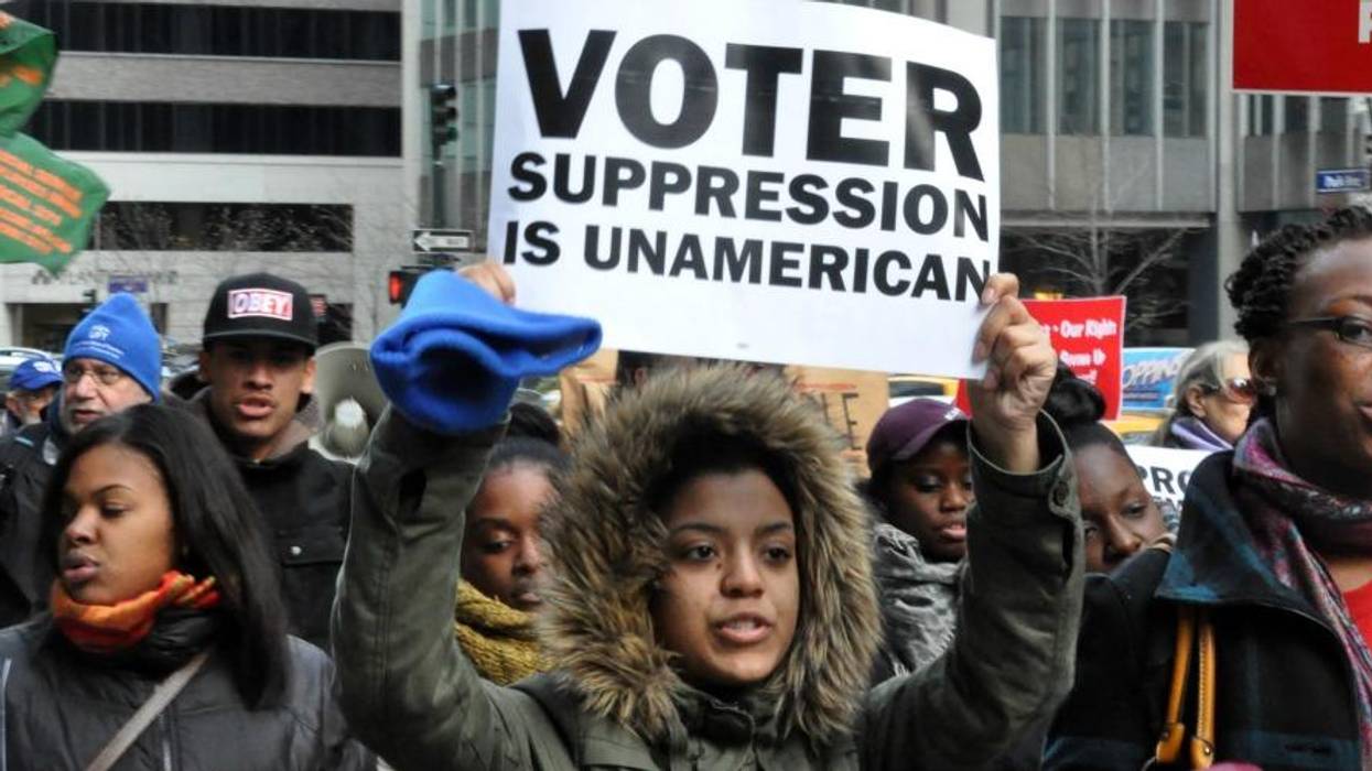 "Voter Suppression Is UnAmerican" the sign reads