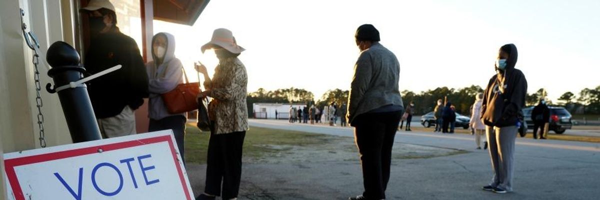Civil Rights Groups Denounce Georgia Officials For Closing Early Voting Sites Ahead of Senate Runoffs