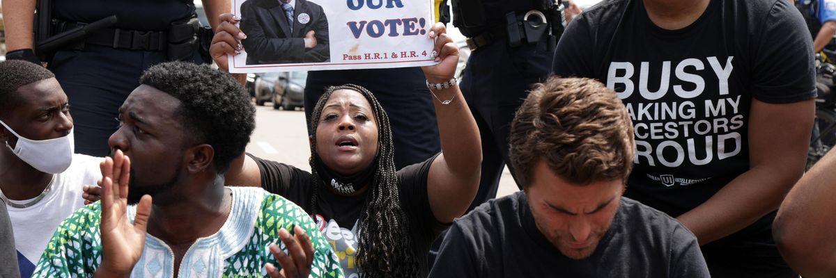 Voting rights advocates attend a protest