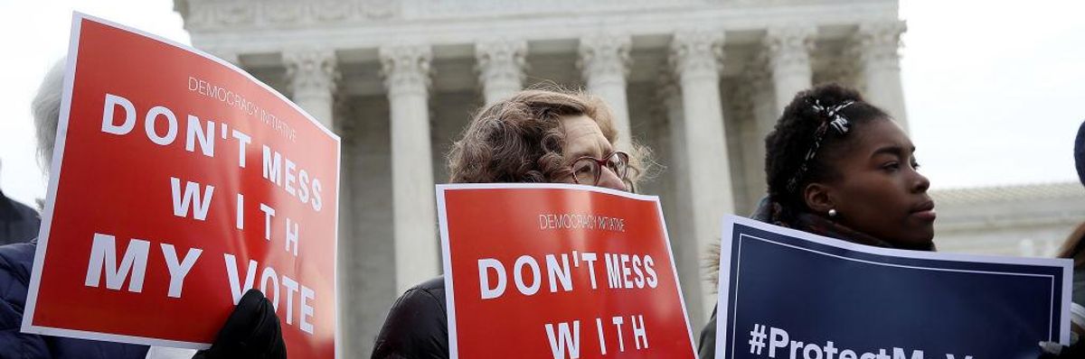 Voting rights advocates protest in front of the Supreme Court.